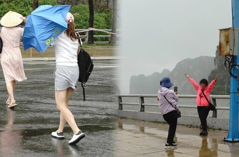 Nhiều du khách ở Quảng Ninh bất chấp gió mạnh, bung ô ra đường ven biển check-in thời điểm bão đổ bộ đất liền