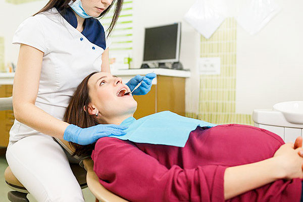 3 bệnh răng miệng phổ biến ở phụ nữ mang thai và cách chăm sóc an toàn- Ảnh 1.
