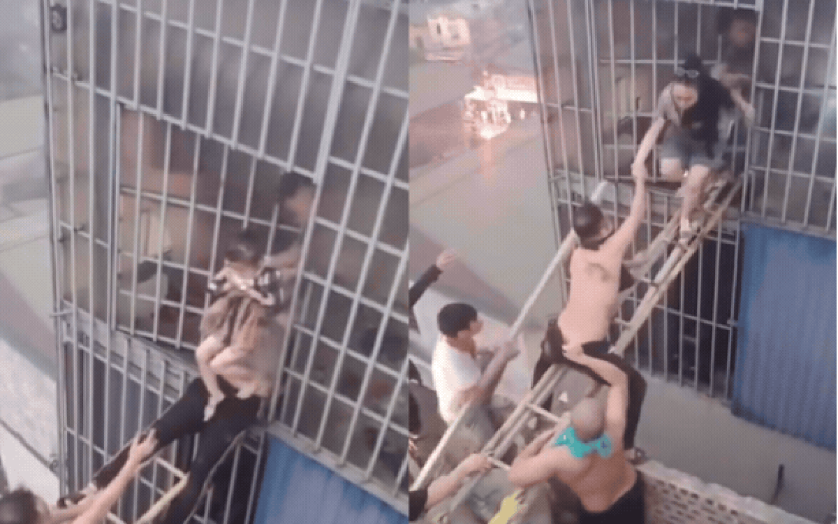 Khoảnh khắc nghẹt thở: Hàng chục người “bắc cầu sinh tử” giữa biển lửa cứu 7 người ở Lĩnh Nam